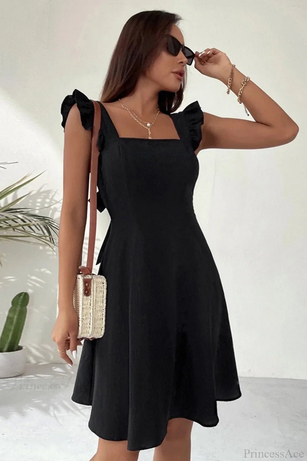 Bianca Sleeveless Mini Dress with Ruffle Tie-back